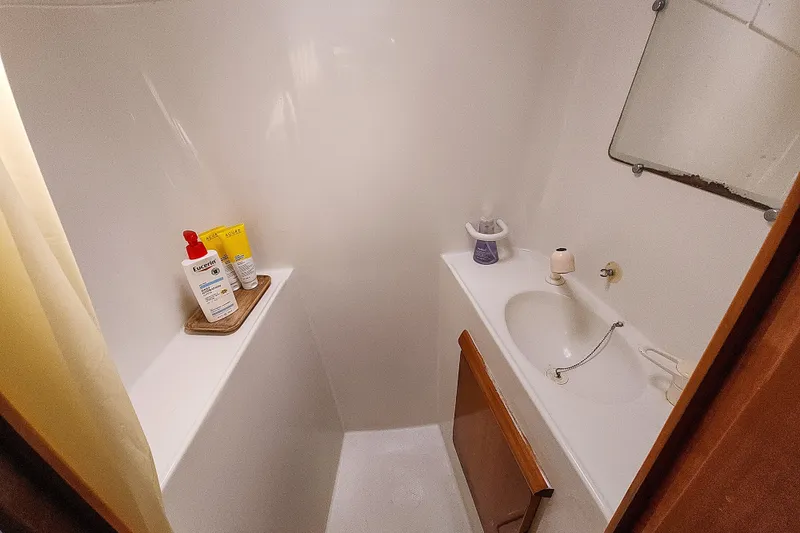 Slide: The Image of Open stainless steel compartment in a 2001 Privilege 435 yacht interior. - 96