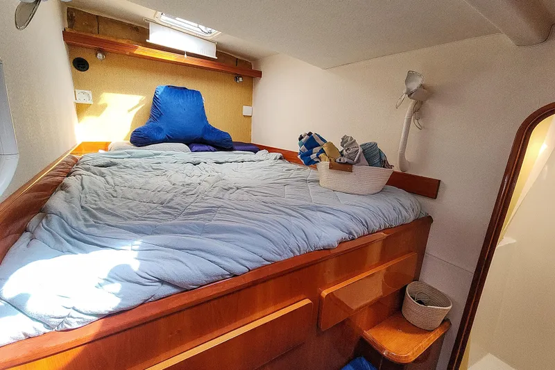 Slide: The Image of Interior of a 2001 Privilege 435 yacht with wooden cabinetry and a Dometic CFX cooler. - 98