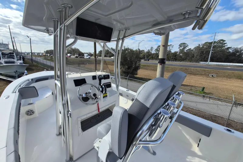 Slide: The Image of 2026 Defiance Catalina 240 boat interior with steering console and seating. - 11