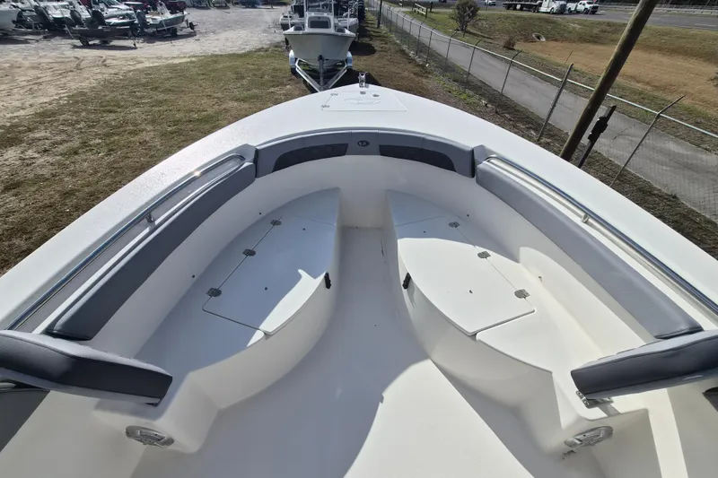 Slide: The Image of 2026 Defiance Catalina 240 boat deck with seating and storage compartments. - 18