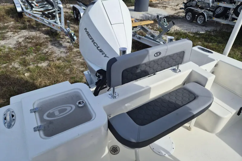 Slide: The Image of 2026 Defiance Catalina 240 boat with Mercury engine and cushioned seating. - 6