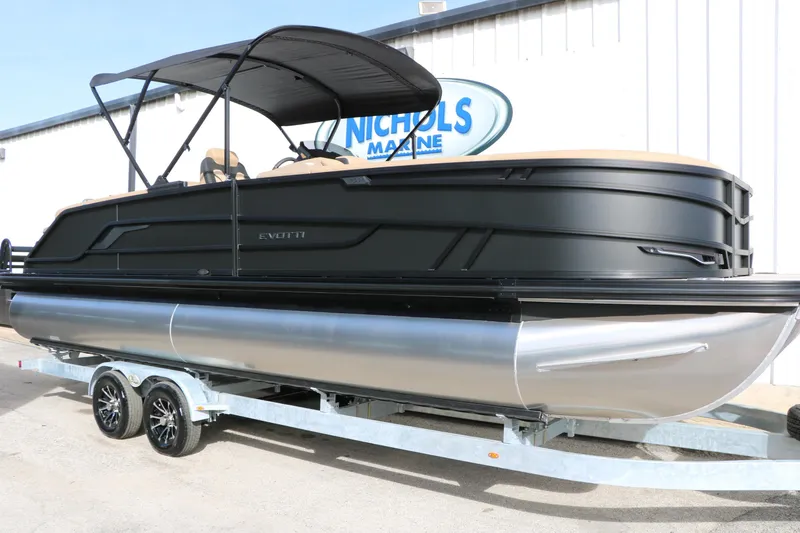Slide: The Image of 2026 Evotti 725QL pontoon boat on trailer, sleek black design, outdoor display. - 2