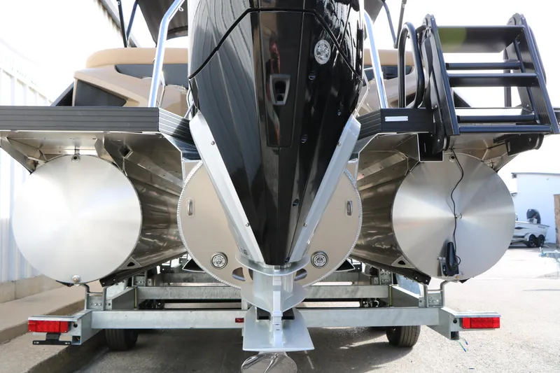 Slide: The Image of 2026 Evotti 725QL pontoon boat on trailer, rear view showing pontoons and ladder. - 23