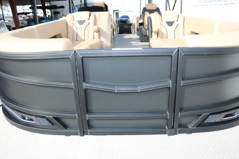 Slide: The Image of Evotti 725QL 2026 pontoon boat with beige seating and sleek black exterior design. - 26