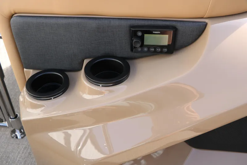 Slide: The Image of Interior of 2026 Evotti 725QL with cup holders and audio control panel. - 37