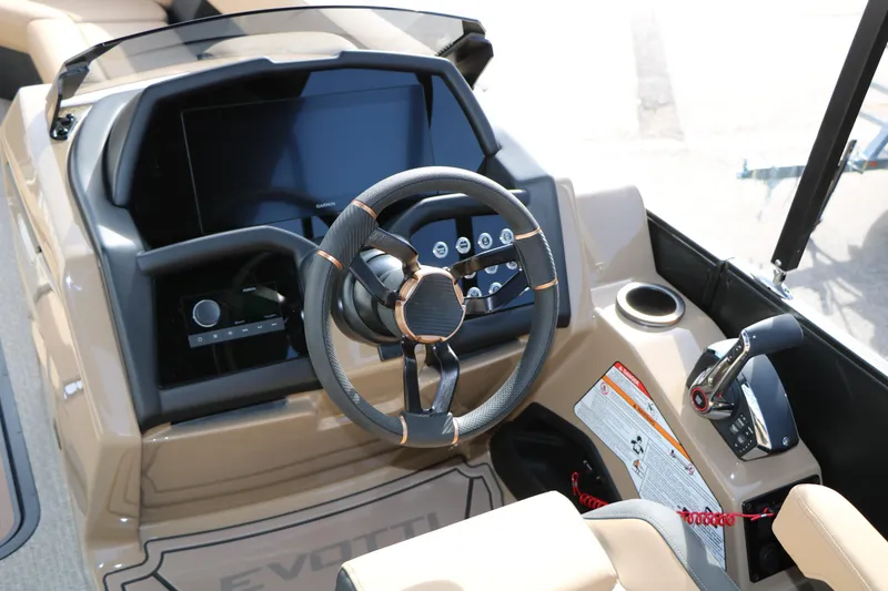 Slide: The Image of Cockpit of 2026 Evotti 725QL boat with modern steering and control panel. - 39