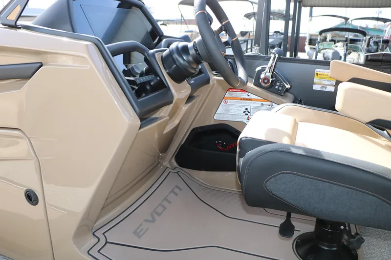 Slide: The Image of Interior of 2026 Evotti 725QL boat, featuring steering wheel and control panel. - 49
