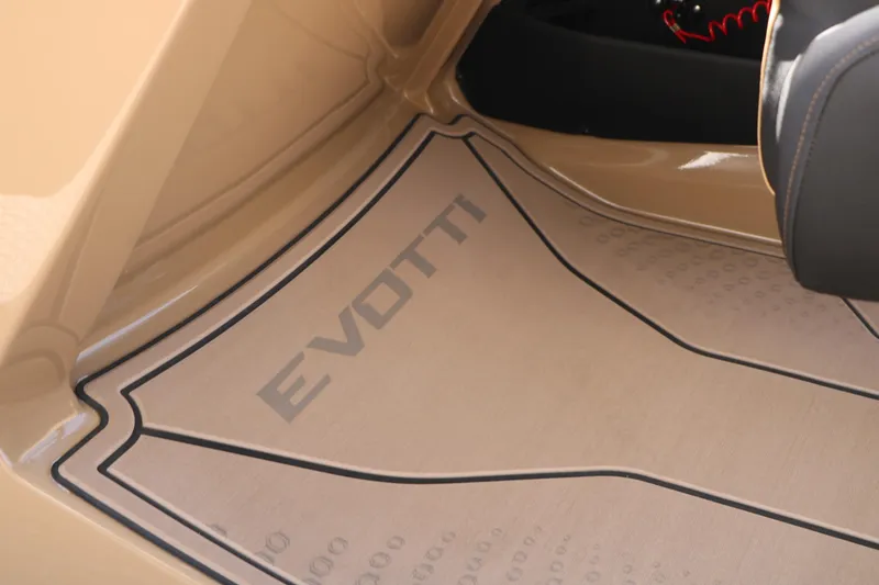 Slide: The Image of Evotti 725QL 2026 car interior with branded floor mat, beige color scheme. - 50