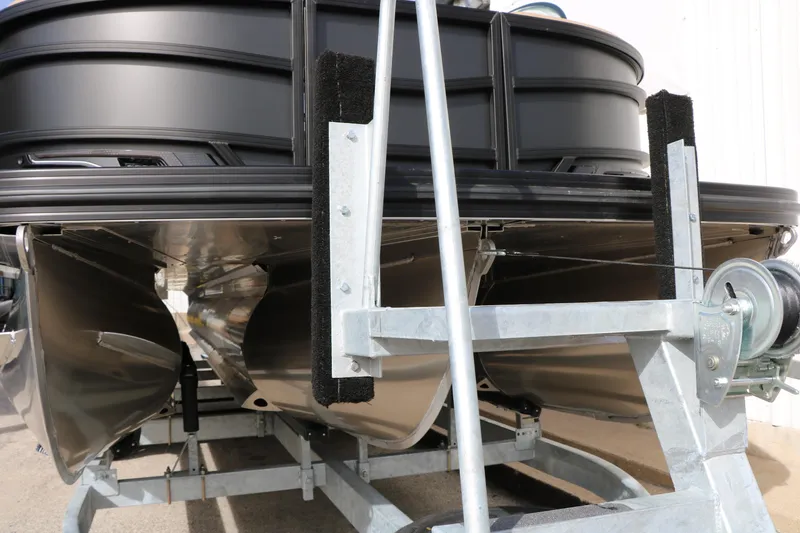 Slide: The Image of 2026 Evotti 725QL pontoon boat on trailer, showcasing sleek design and sturdy construction. - 56