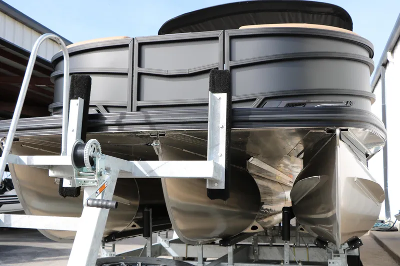 Slide: The Image of Evotti 725QL 2026 pontoon boat on trailer, showcasing sleek design and sturdy construction. - 6