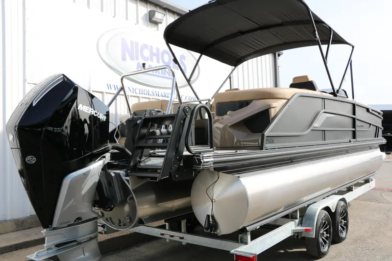 Slide: The Image of 2026 Evotti 725QL pontoon boat with Mercury engine on trailer. - 8
