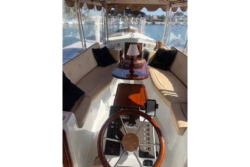 Slide: The Image of Interior of 2002 Duffy Classic 21 boat with elegant seating and wooden accents. - 10