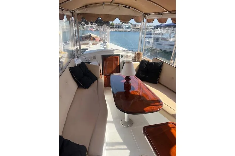 Slide: The Image of Luxurious interior of 2002 Duffy Classic 21 boat with elegant seating and table. - 11