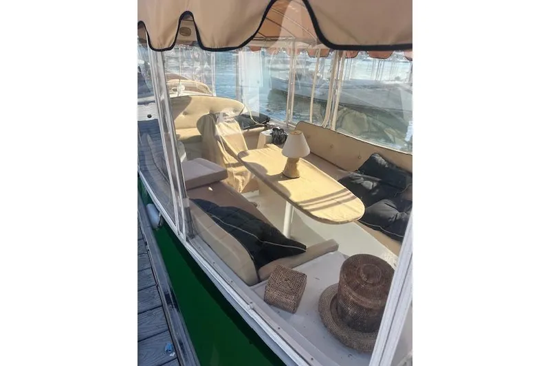 Slide: The Image of Interior of 2002 Duffy Classic 21 boat with seating and table. - 3