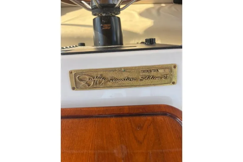 Slide: The Image of Plaque on 2002 Duffy Classic 21 boat, featuring "Signature Edition 21" inscription. - 9