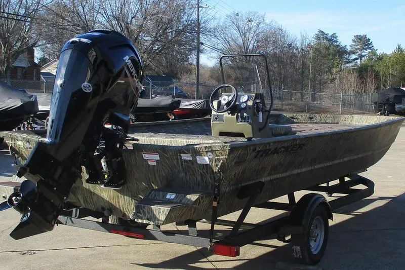 Slide: The Image of 2026 Tracker Grizzly 2072 CC boat on trailer, featuring a powerful Mercury outboard motor. - 4
