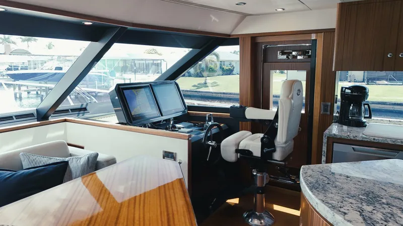 Slide: The Image of Luxurious interior of 2015 Ocean Alexander 72 yacht with helm, seating, and modern amenities. - 10