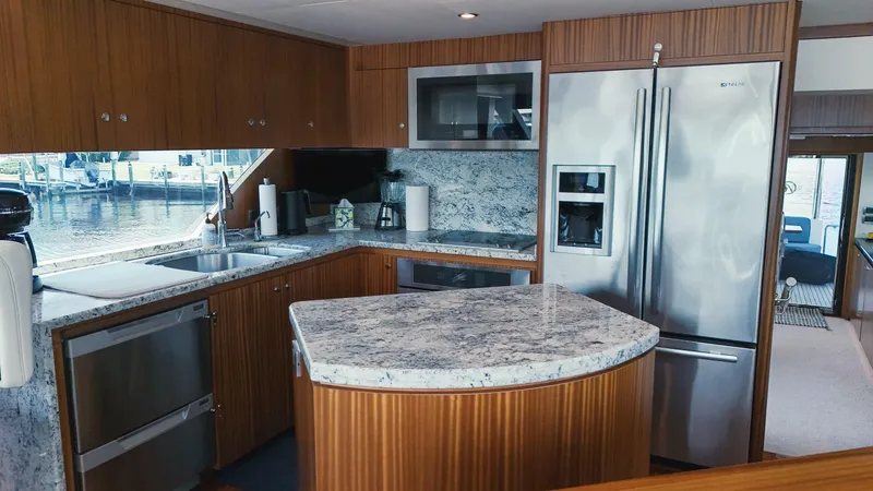 Slide: The Image of Luxurious kitchen interior of 2015 Ocean Alexander 72 yacht with modern appliances and granite countertops. - 11