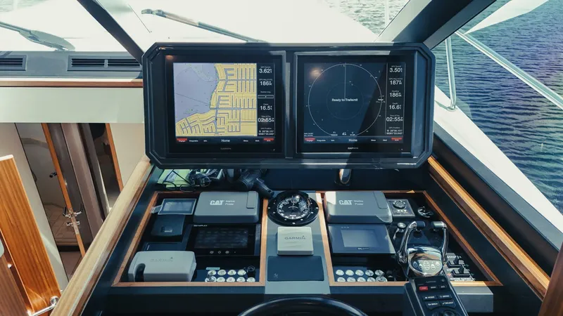 Slide: The Image of Cockpit of 2015 Ocean Alexander 72 yacht with navigation screens and controls. - 13