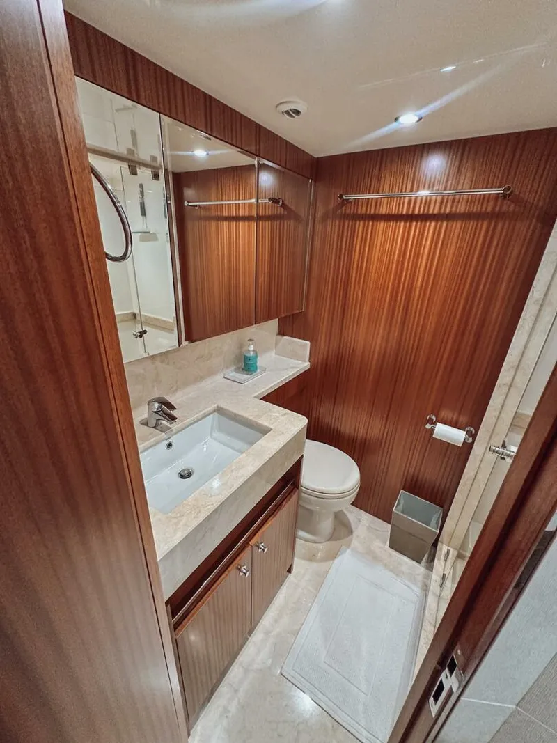 Slide: The Image of Luxurious bathroom in 2015 Ocean Alexander 72 yacht with wood paneling and modern fixtures. - 20