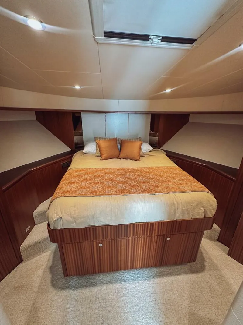 Slide: The Image of Luxurious bedroom interior of 2015 Ocean Alexander 72 yacht with elegant bedding and wood accents. - 21