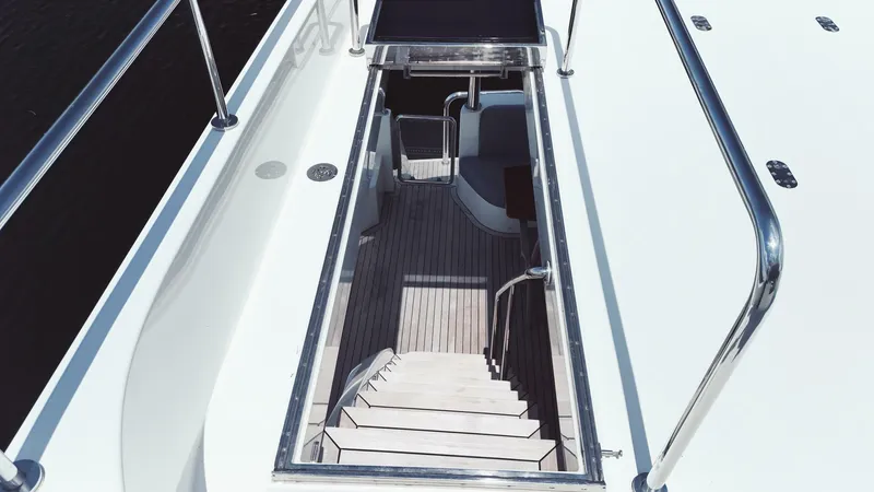 Slide: The Image of Staircase on 2015 Ocean Alexander 72 yacht, featuring sleek design and polished railings. - 8