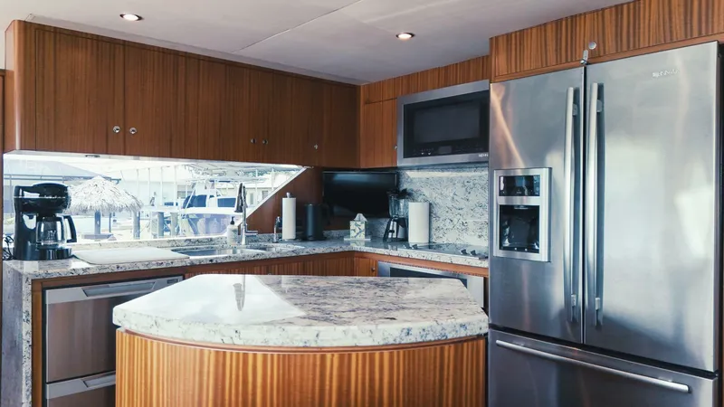 Slide: The Image of Luxurious kitchen interior of 2015 Ocean Alexander 72 yacht with modern appliances and granite countertops. - 9