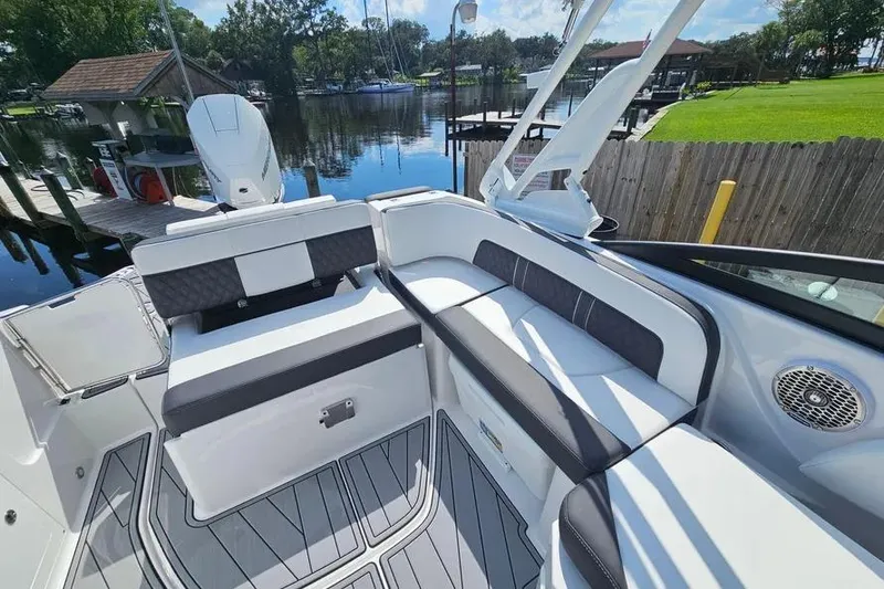 Slide: The Image of 2026 Monterey M-45 boat interior with sleek seating and waterfront view. - 10