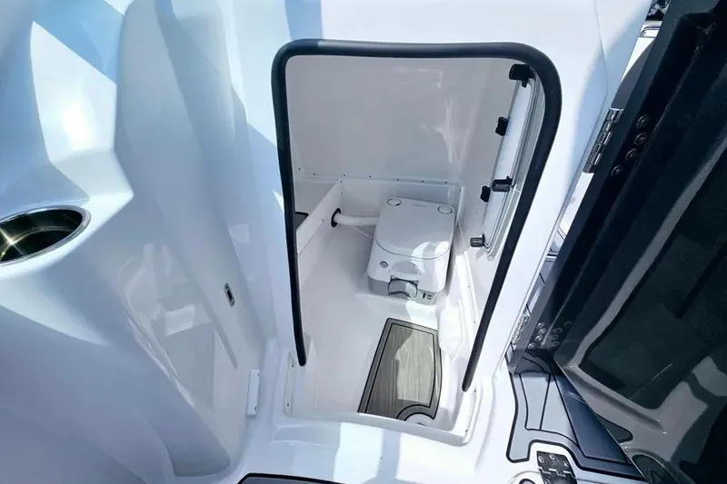 Slide: The Image of 2026 Monterey M-45 boat interior with compact marine toilet and sleek design. - 13