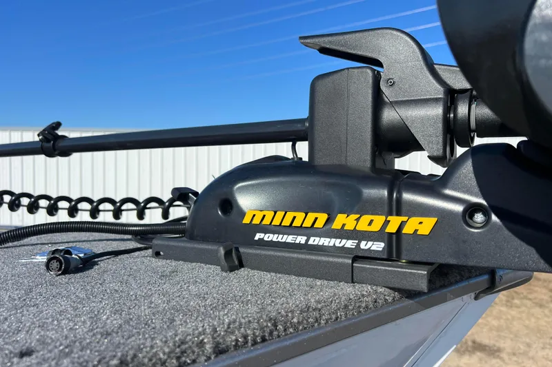 Slide: The Image of 2016 Lund 1675 Impact Sport boat trailer tire on asphalt road. - 10