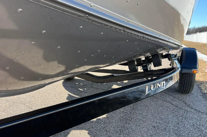 Slide: The Image of 2016 Lund 1675 Impact Sport boat on trailer, close-up view. - 21