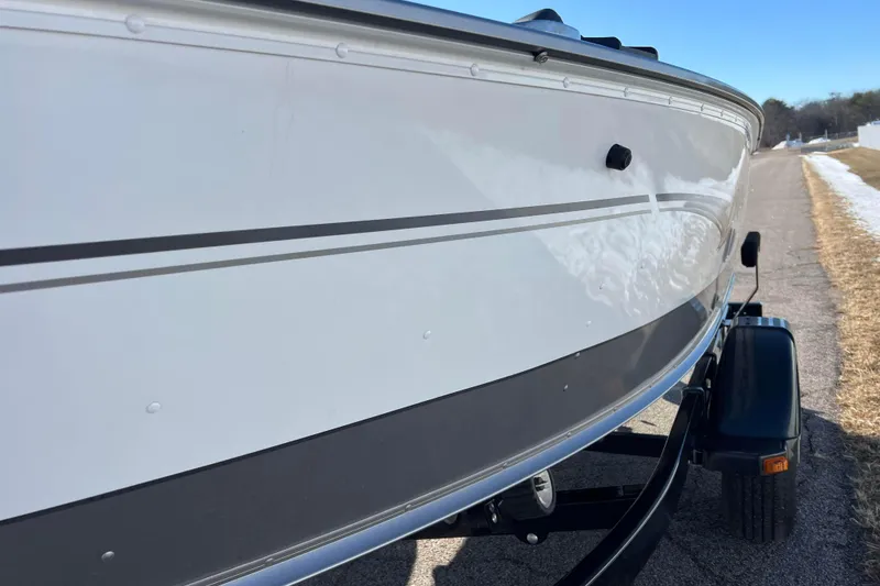 Slide: The Image of 2016 Lund 1675 Impact Sport boat on trailer, close-up view. - 22