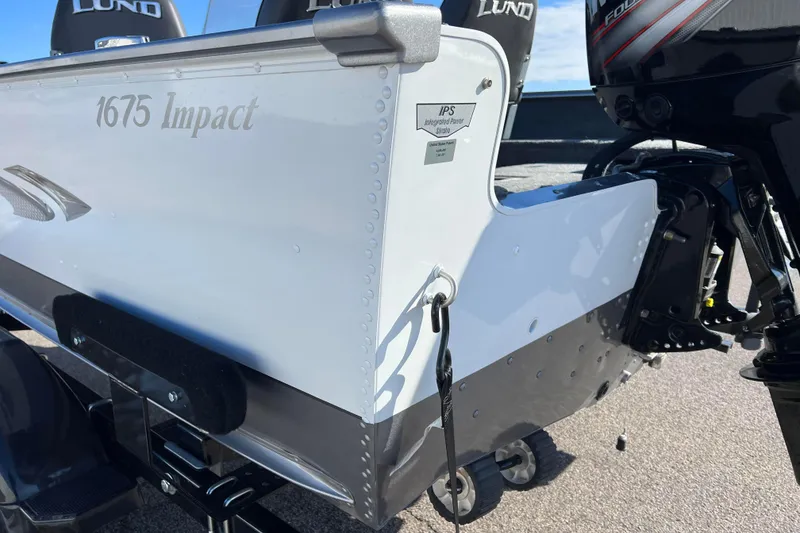 Slide: The Image of Close-up of a 2016 Lund 1675 Impact Sport trailer tire on asphalt. - 26