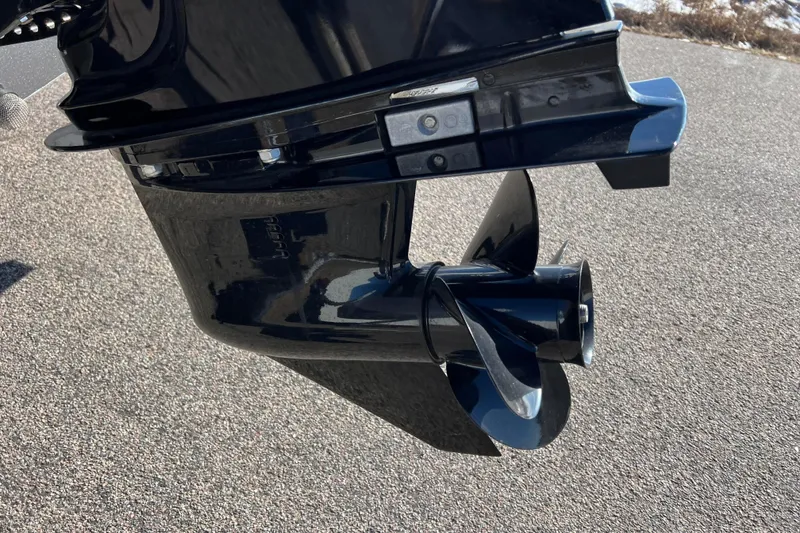 Slide: The Image of 2016 Lund 1675 Impact Sport boat rear view with motor and trailer. - 27