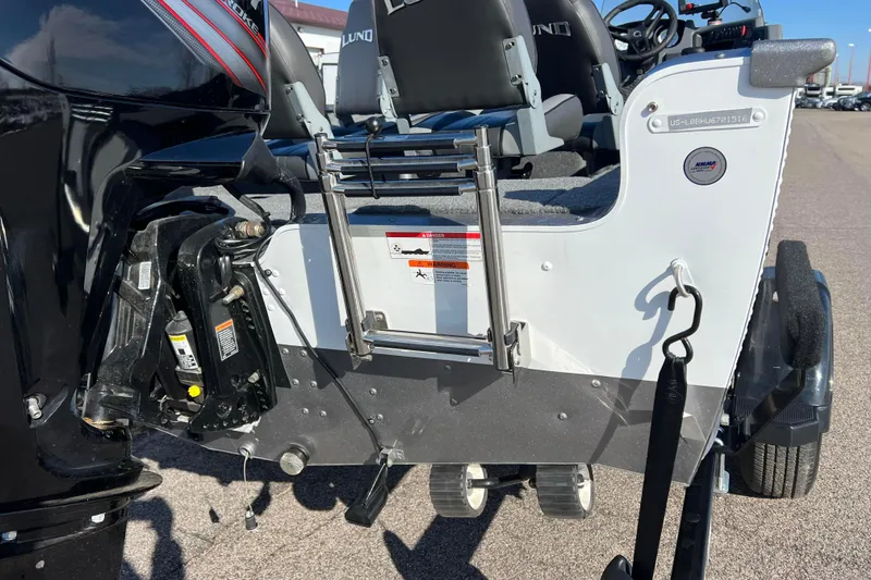 Slide: The Image of Label on a 2016 Lund 1675 Impact Sport boat, showing Mercury Marine engine details. - 29