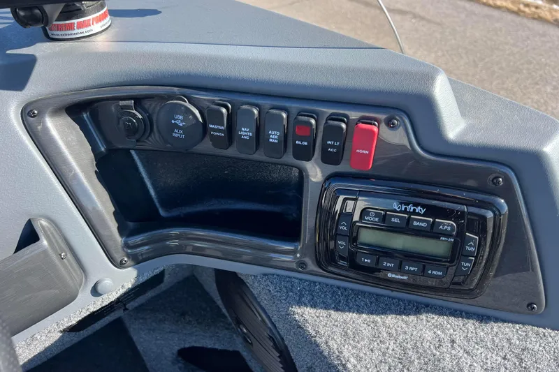 Slide: The Image of 2016 Lund 1675 Impact Sport boat rear view with motor and ladder. - 30