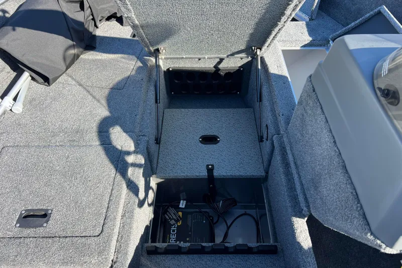 Slide: The Image of 2016 Lund 1675 Impact Sport boat storage compartment, open and empty. - 36