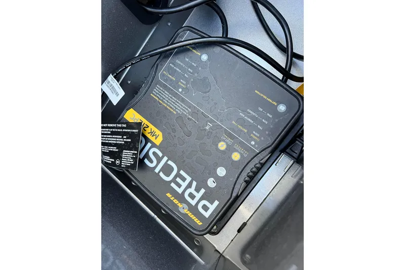 Slide: The Image of 2016 Lund 1675 Impact Sport boat storage compartment with open hatch, showcasing interior details. - 37