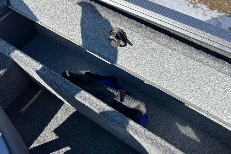 Slide: The Image of 2016 Lund 1675 Impact Sport boat interior with gray and black seating. - 41