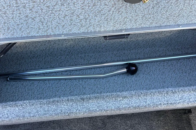 Slide: The Image of 2016 Lund 1675 Impact Sport boat storage compartment with bag inside. - 42