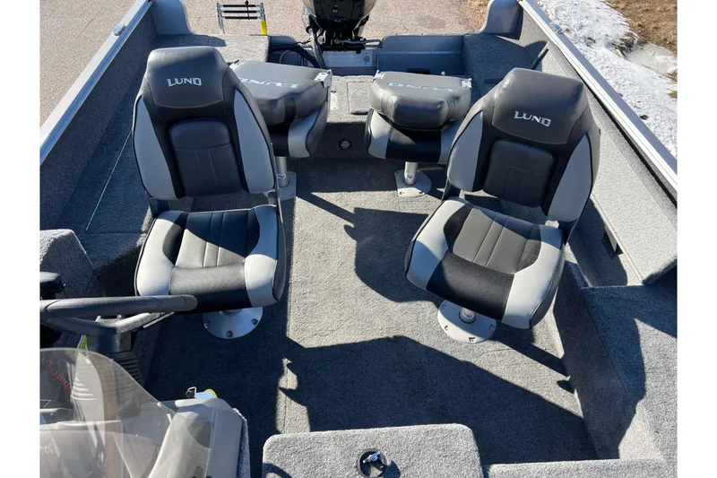 Slide: The Image of 2016 Lund 1675 Impact Sport boat interior with two seats and motor. - 46