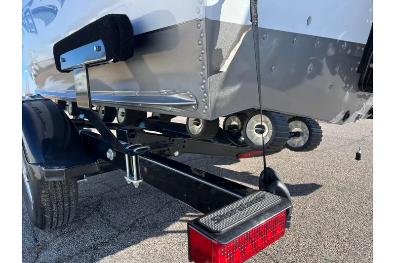 Slide: The Image of 2016 Lund 1675 Impact Sport boat on trailer, close-up of hull and support wheels. - 49