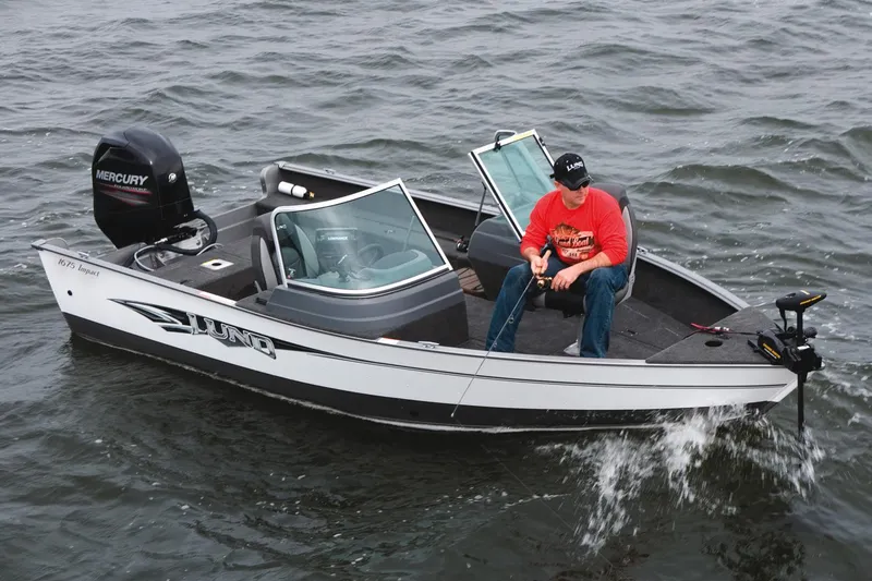 Slide: The Image of Manufacturer Provided Image: 2016 Lund 1675 Impact Sport fishing boat, top view, dual seats, spacious deck, outboard motor. - 53