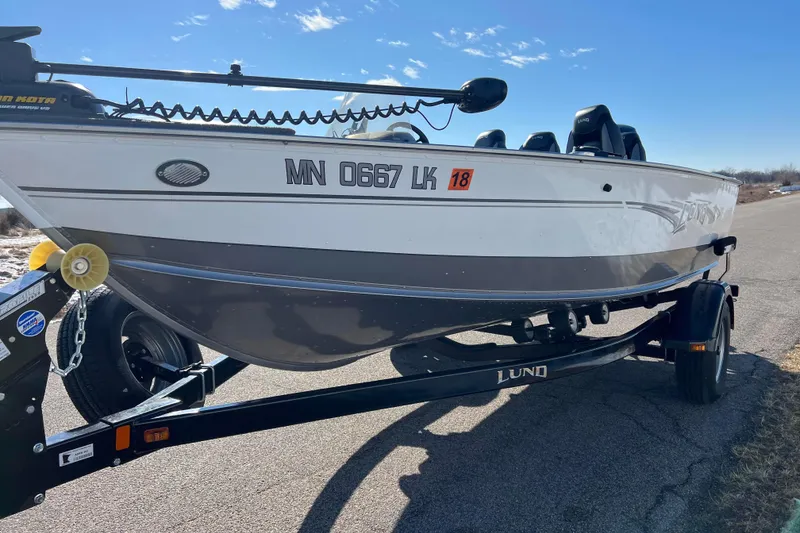 Slide: The Image of Close-up of a 2016 Lund 1675 Impact Sport boat tachometer displaying 12.2 volts. - 6
