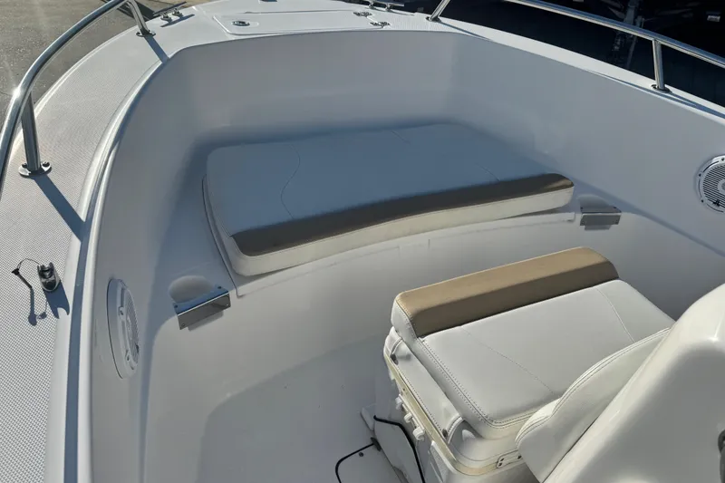 Slide: The Image of 2019 Edgewater 188CC boat interior with cushioned seating and stainless steel railings. - 6