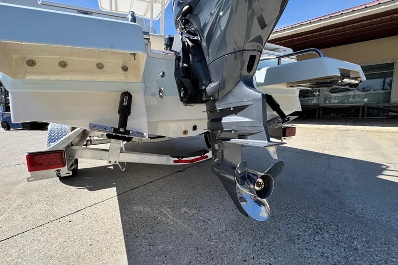 Slide: The Image of 2019 Edgewater 188CC boat on trailer, showcasing outboard motor and propeller. - 7