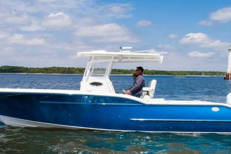 The Image of 2027 Buddy Davis Davis 28 boat cruising on a sunny day with blue skies. - 1