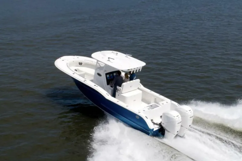 Slide: The Image of 2027 Buddy Davis Davis 28 boat cruising on open water with dual engines. - 3