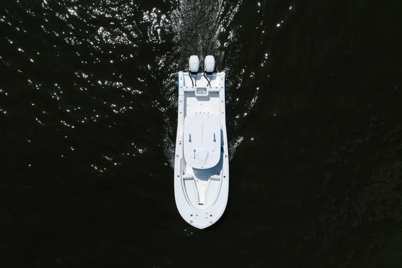 Slide: The Image of Aerial view of 2027 Buddy Davis 28 Center Console boat on dark water. - 8