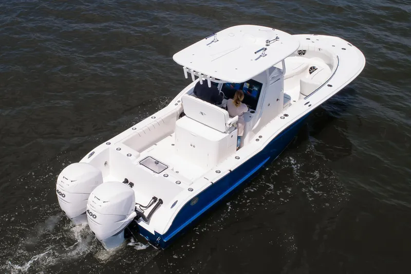 Slide: The Image of 2027 Buddy Davis 28 Center Console boat cruising on open water. - 9